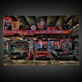 NOSTALGIC EARLY CORVETTES SURROUNDED BY RUSTIC SIGNAGE